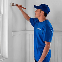 handyman painting new wall
