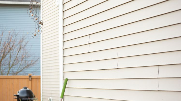 https://www.handymanconnection.net/calgary/wp-content/uploads/sites/14/2025/08/Should-You-Repair-Or-Replace-Your-Homes-Siding.jpg