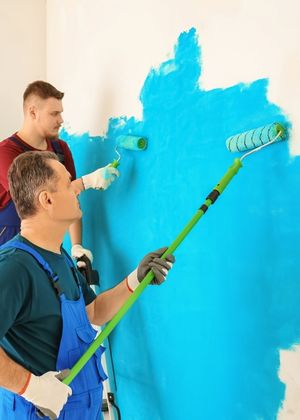 A Woman Painting Using a Paint Roller