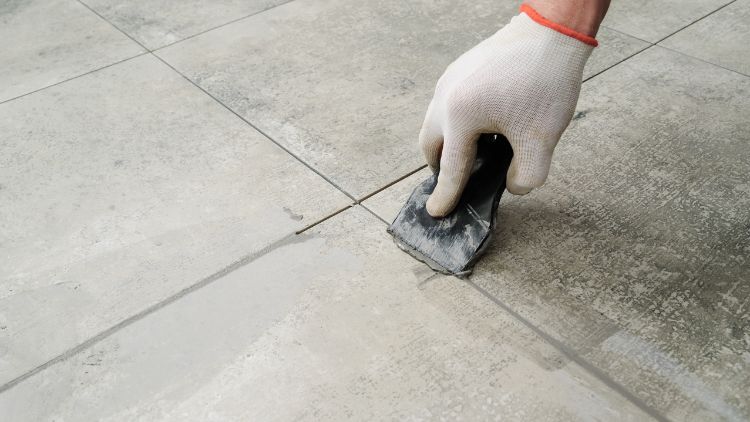 Grouting ceramic tiles
