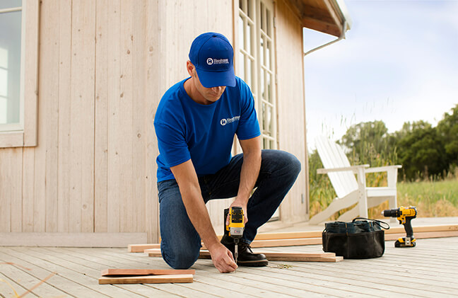 handyman installing new deck boards