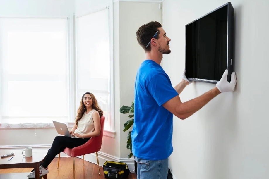 handyman installing flat screen tv in a Evergreen, CO, home