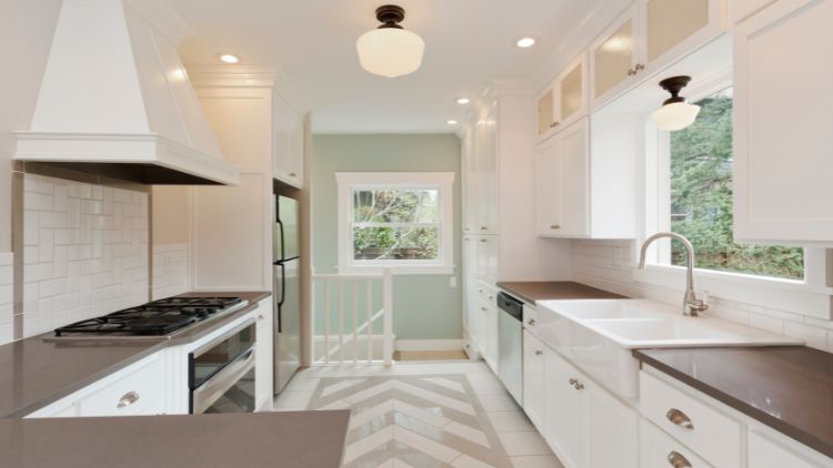 https://www.handymanconnection.net/kelowna/wp-content/uploads/sites/24/2025/02/Banner_-How-Many-Paint-Coats-Are-Needed-For-A-Kitchen.jpg