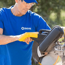 Handyman using power tools to perform carpentry services