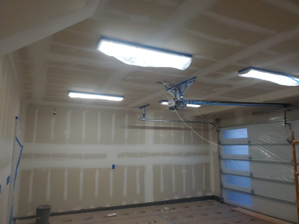 garage drywall installation project in progress by our craftsmen