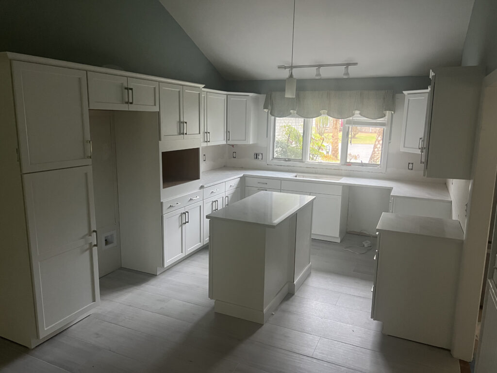 completed kitchen remodel with new cabinets and flooring