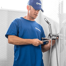 plumbing handyman installing new shower fixtures