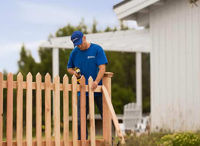 handyman installing fence