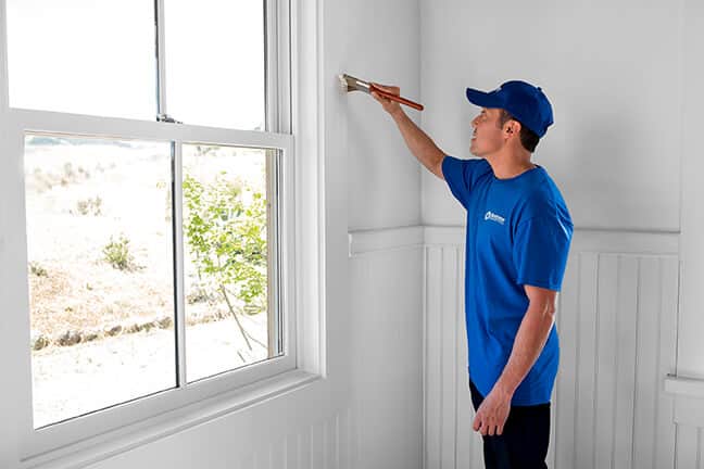 handyman from Handyman Connection painting interior home wall