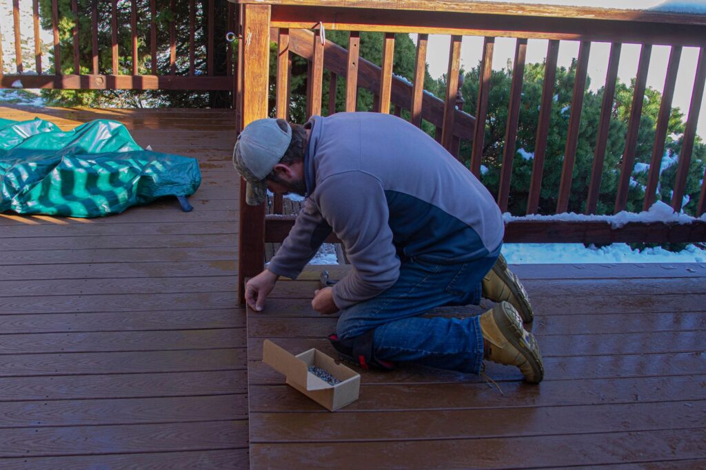 handyman in Jeffersonville, KY, installing new deck boards