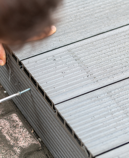 Man assembling composite deck
