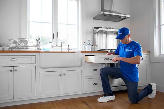 handyman installing new kitchen drawer
