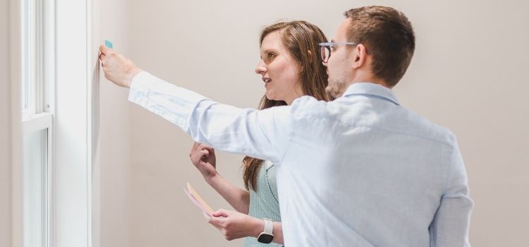 Couple Choosing Paint Color of Wall