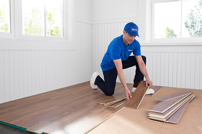 handyman installing new hardwood flooring