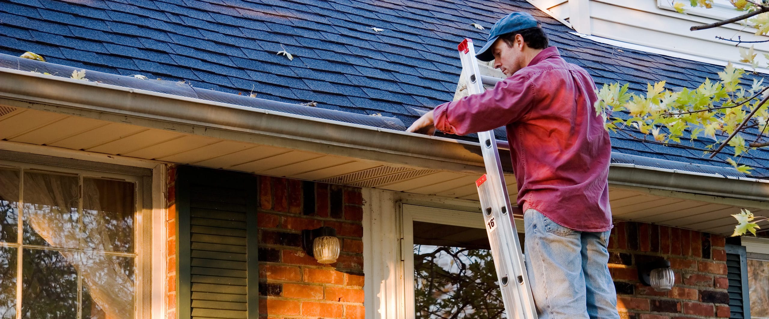 https://www.handymanconnection.net/wp-content/uploads/2017/10/bigstock-Man-Cleaning-Gutters-9331940-e1566484011680.jpg